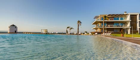 Indoor pool, outdoor pool, pool umbrellas, sun loungers