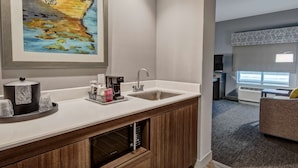 A modern kitchen with a built-in oven, a coffee maker, and a sink. - Hampton Inn & Suites San Jose Airport (San Jose)
