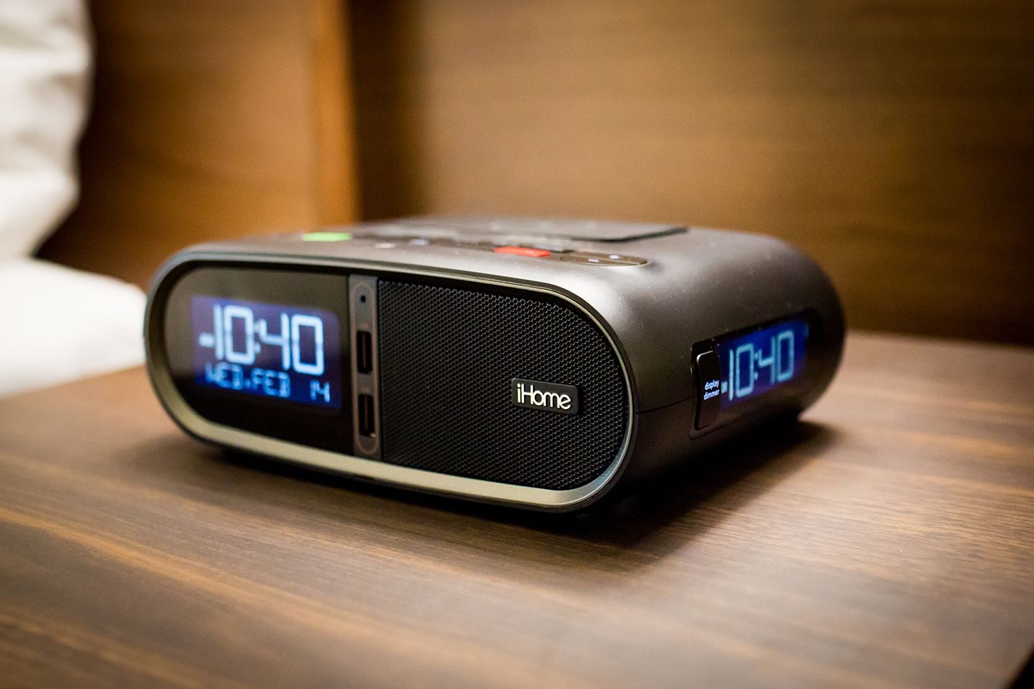 A digital alarm clock with a display showing 10:40.