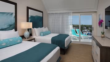 A hotel room with two beds, a ceiling fan, a view of the pool and resort, and a balcony with a chair.