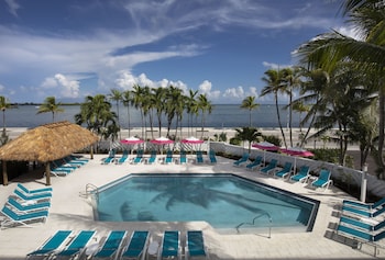 Indoor pool, outdoor pool, open 7:00 AM to 10:00 PM, pool umbrellas at The Laureate Key West