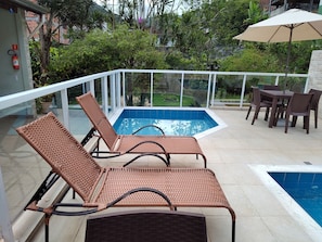 Outdoor pool, open 10 AM to 9 PM, pool umbrellas, sun loungers