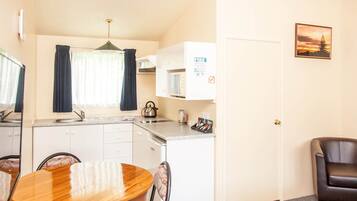 One Bedroom | Desk, laptop workspace, iron/ironing board, cots/infant beds