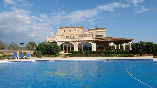 A large, two-story building with a swimming pool in front. - Villa 18 pax with large pool close to Es Trenc (Campos - Sa Rapita)