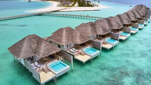 Overwater bungalows with pools, a pier, and a beach. - Sun Siyam Iru Veli - 24 Hours All-Inclusive (Aloofushi)
