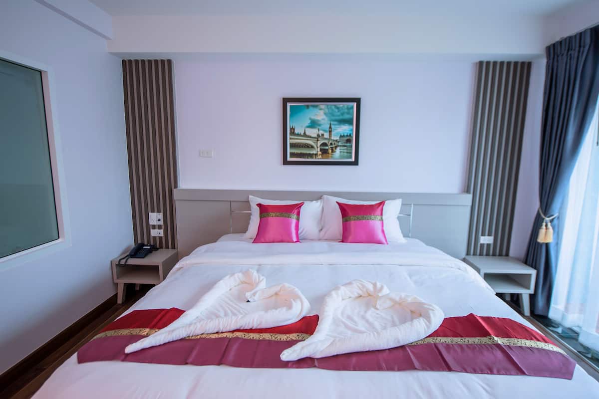 superior room, 1 king bed, refrigerator | in-room safe, individually decorated, desk, laptop workspace