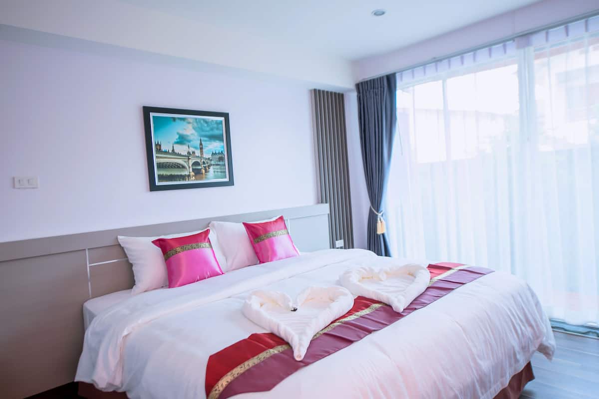 superior room, 1 king bed, refrigerator | in-room safe, individually decorated, desk, laptop workspace