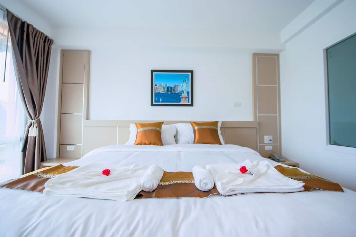 superior room, 1 king bed, refrigerator | in-room safe, individually decorated, desk, laptop workspace