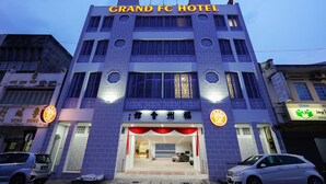 A hotel with a prominent "Grand FC Hotel" sign, multiple floors, and a modern facade. - Grand FC Hotel (George Town)