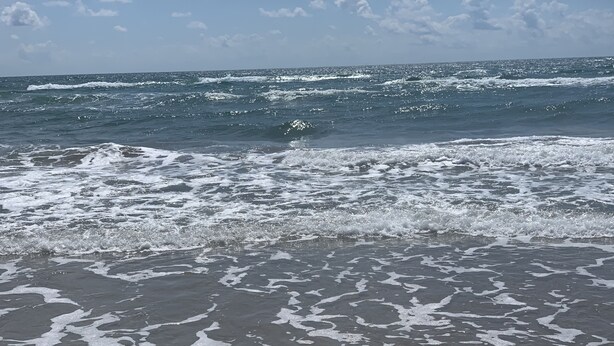 A beach with waves crashing onto the shore. - Beachfront condo: Create some memories! (South Padre Island)