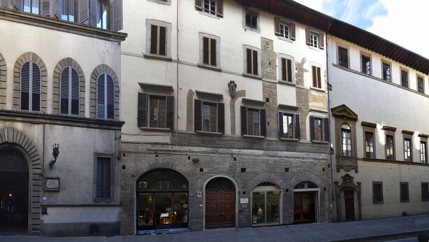 A historic building with multiple windows and doors, featuring classic architectural elements like arches and shutters. - The emotion of living in a Renaissance palace in the heart of Florence (Firenze)
