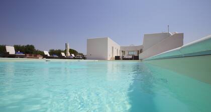 A modern villa set between Sava and Campomarino in a peaceful private setting.