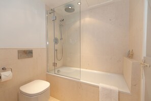 Bathtub, hair dryer, towels, soap