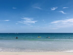 A beach with clear blue water and a sandy shore. - Sunrise Dreamz - Steps from the Beach equipped with all you need! (Fort Pierce)