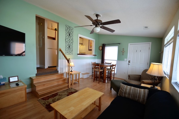 Living and dining area with sleeper queen size couch