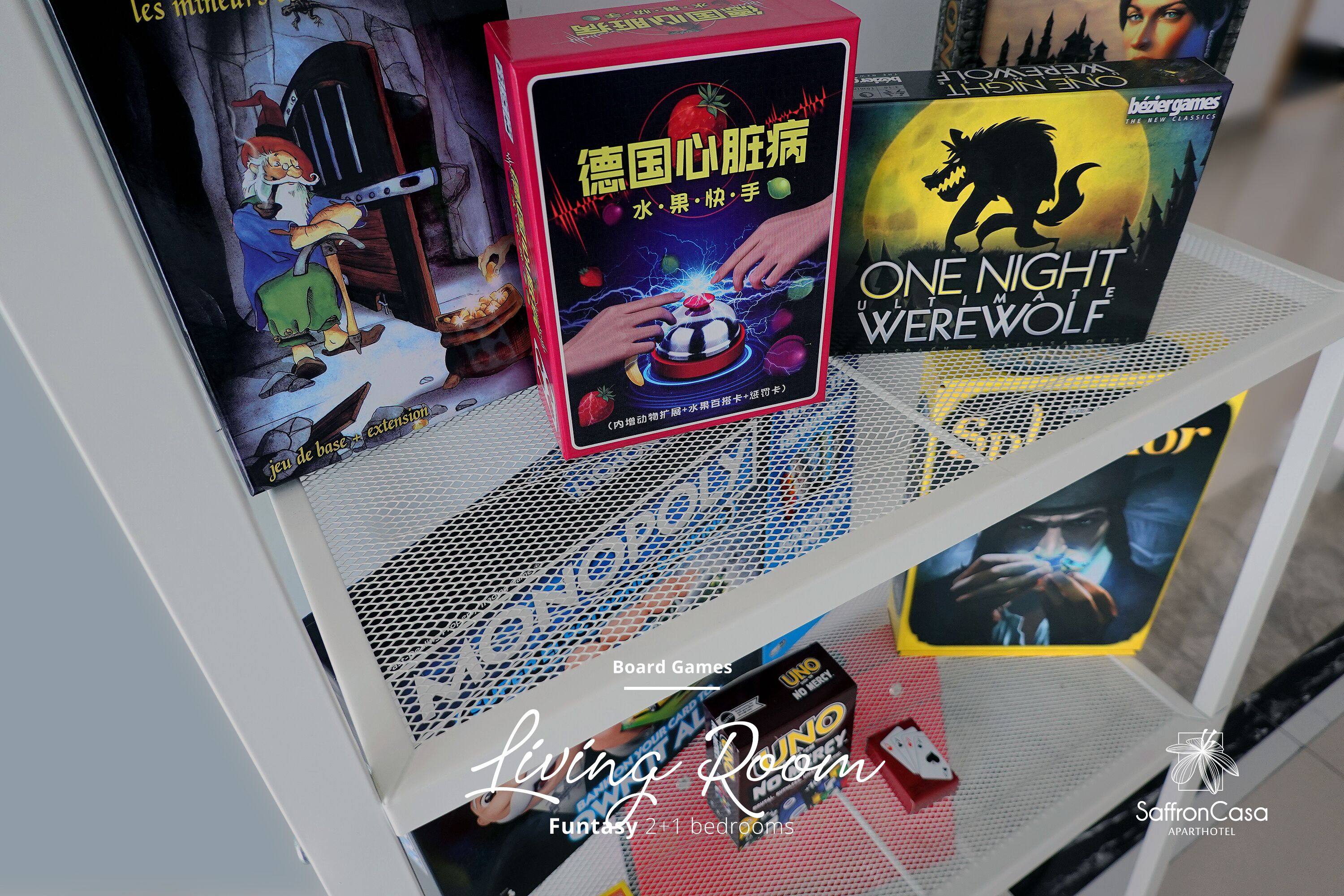 A shelf with board games, including 'One Night at the Witch's House' and 'One Night at the Werewolf'.