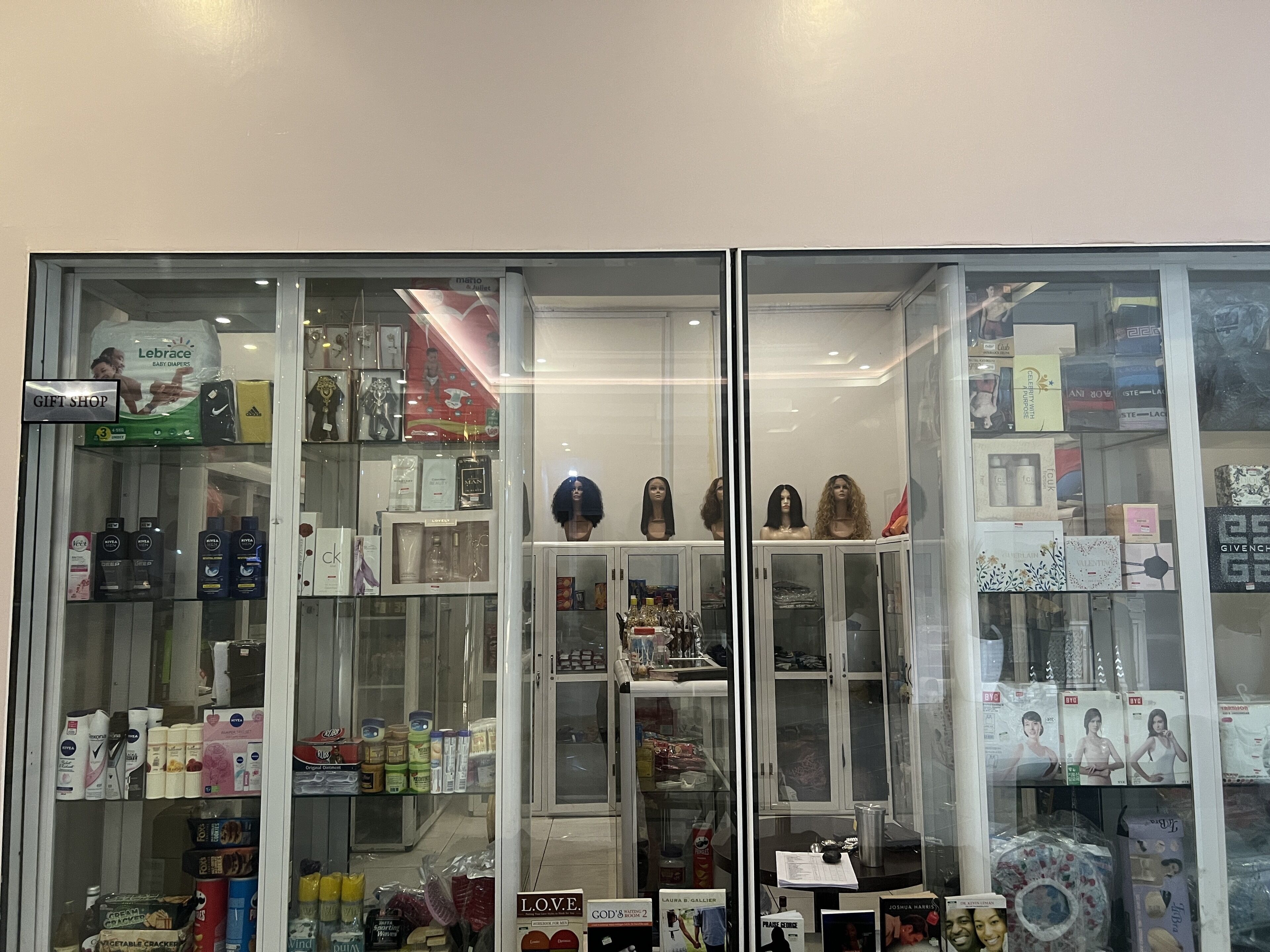 A gift shop with various items including baby products, cosmetics, and accessories.