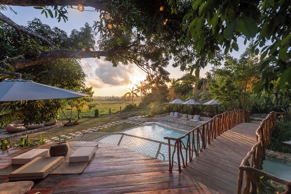 2 outdoor pools, open 7:00 AM to 9:00 PM, pool umbrellas, pool loungers