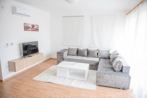 Family Apartment, 2 Bedrooms, River View, Garden Area | Living room | Flat-screen TV