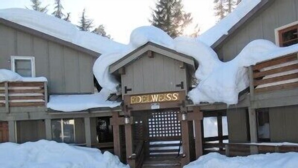 A building with a sign reading "Edelweiss" at the entrance, surrounded by snow. - Prime Mt. Hood/Government Camp Loop Condo Background Beautiful 11,230 ft Mt Hood (Government Camp)