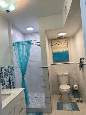 Shower, hair dryer, towels, soap