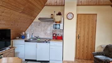 Fridge, microwave, stovetop, coffee/tea maker