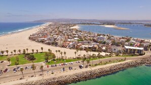 A coastal town with a beach, marina, and residential buildings. - OCEANFRONT LUXURY—Summer booking fast so Hurry and book!<br> (San Diego)
