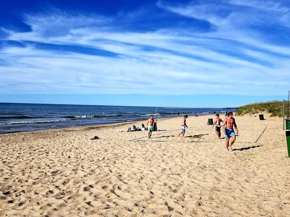 Enjoy beach volleyball and social gatherings in this lively public beach area.