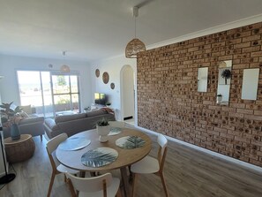 Superior Apartment, 2 Bedrooms, Ocean View, Beachside | Living area | Flat-screen TV