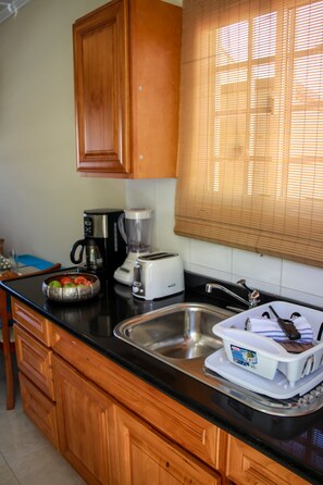 Full-size fridge, microwave, stovetop, coffee/tea maker