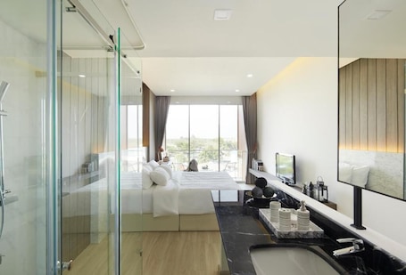 Shower, rainfall showerhead, hair dryer, towels. Phurinda Residence