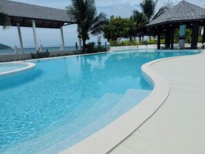Outdoor pool, open 7:00 AM to 7:00 PM, pool umbrellas, sun loungers