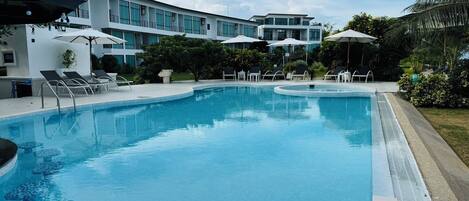 Outdoor pool, open 7:00 AM to 7:00 PM, pool umbrellas, pool loungers