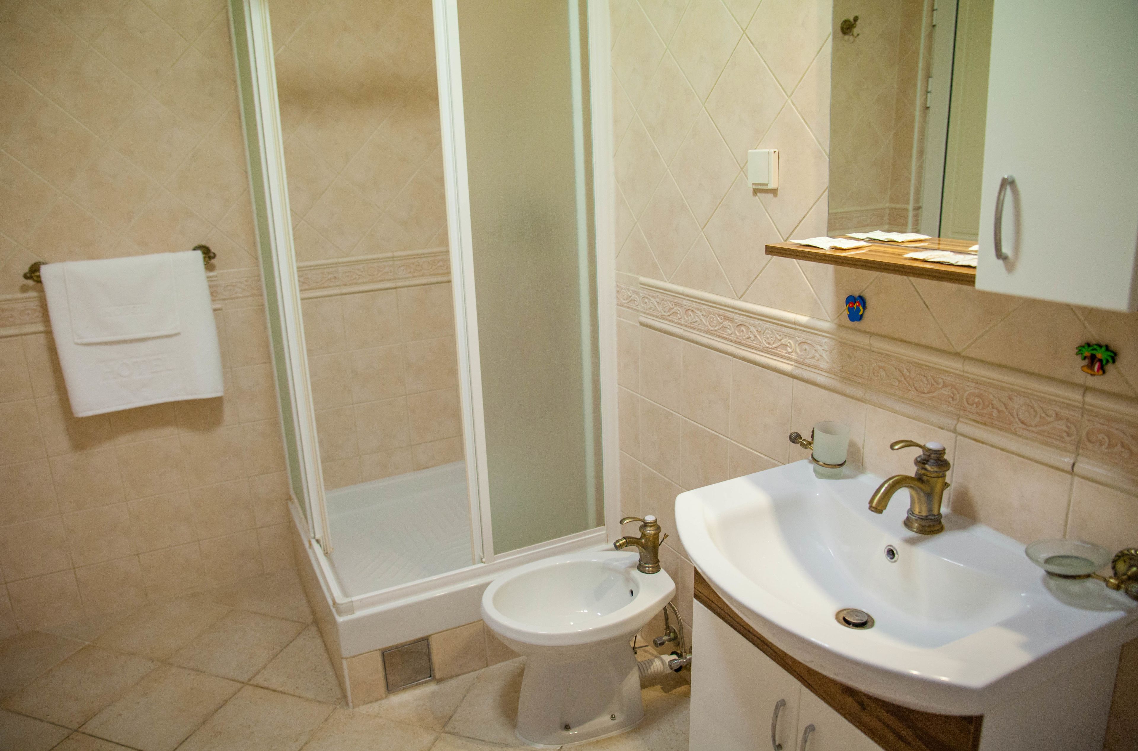 A bathroom with a bathtub, a sink, and a toilet.
