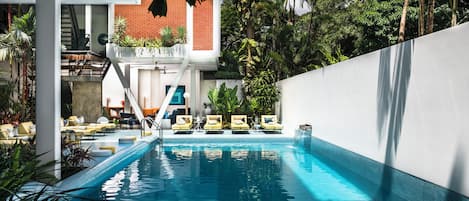 Outdoor pool, open 7 AM to 10 PM, pool umbrellas, sun loungers