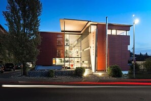 A modern building with a glass facade, a red exterior, and a sign that reads 'ROTES HAUS.' - Rotes Haus (Ueberlingen)