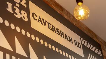 A sign with 'Caversham Rd' and 'Reading' indicating a location.
