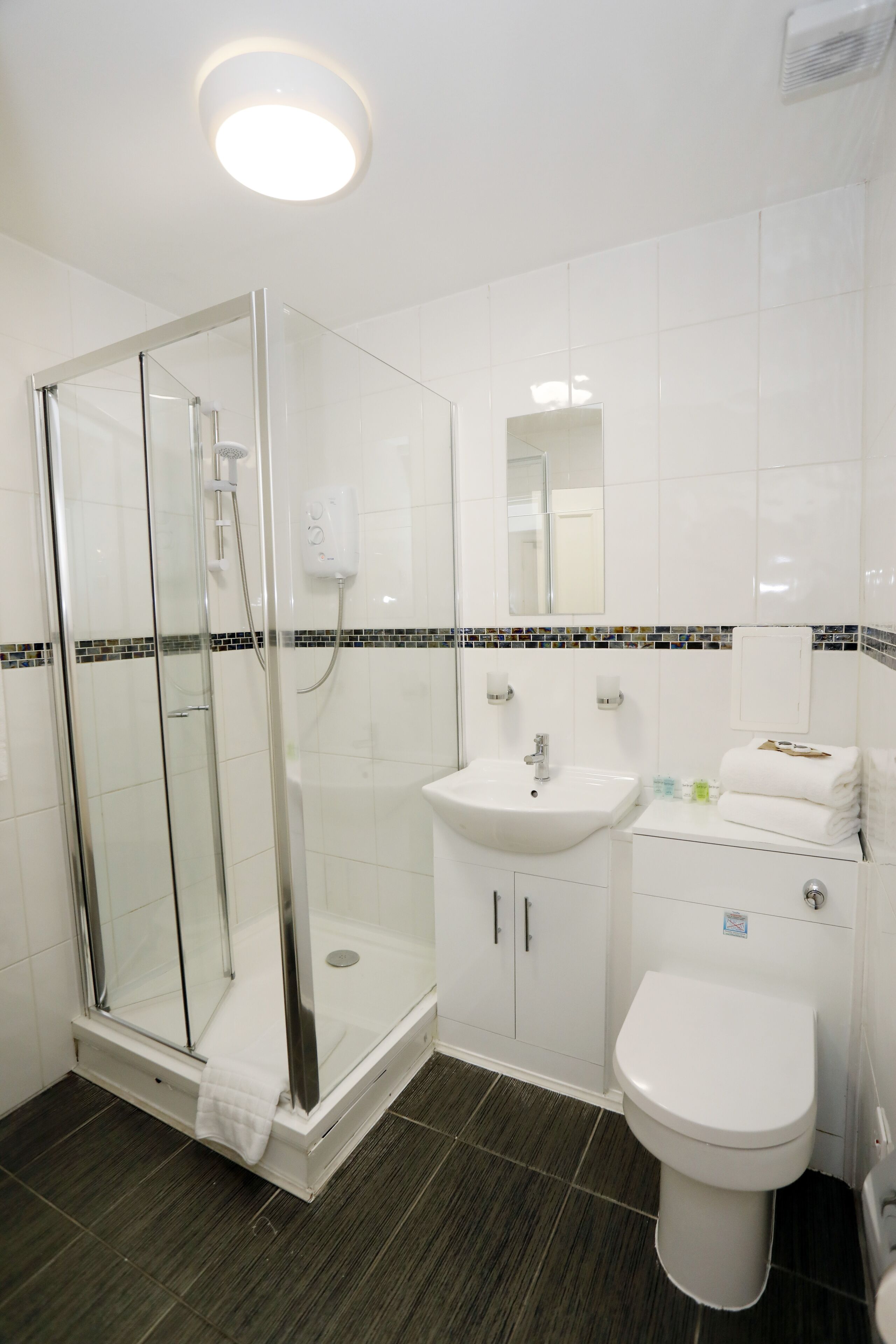 family room | bathroom | shower, free toiletries, hair dryer, towels