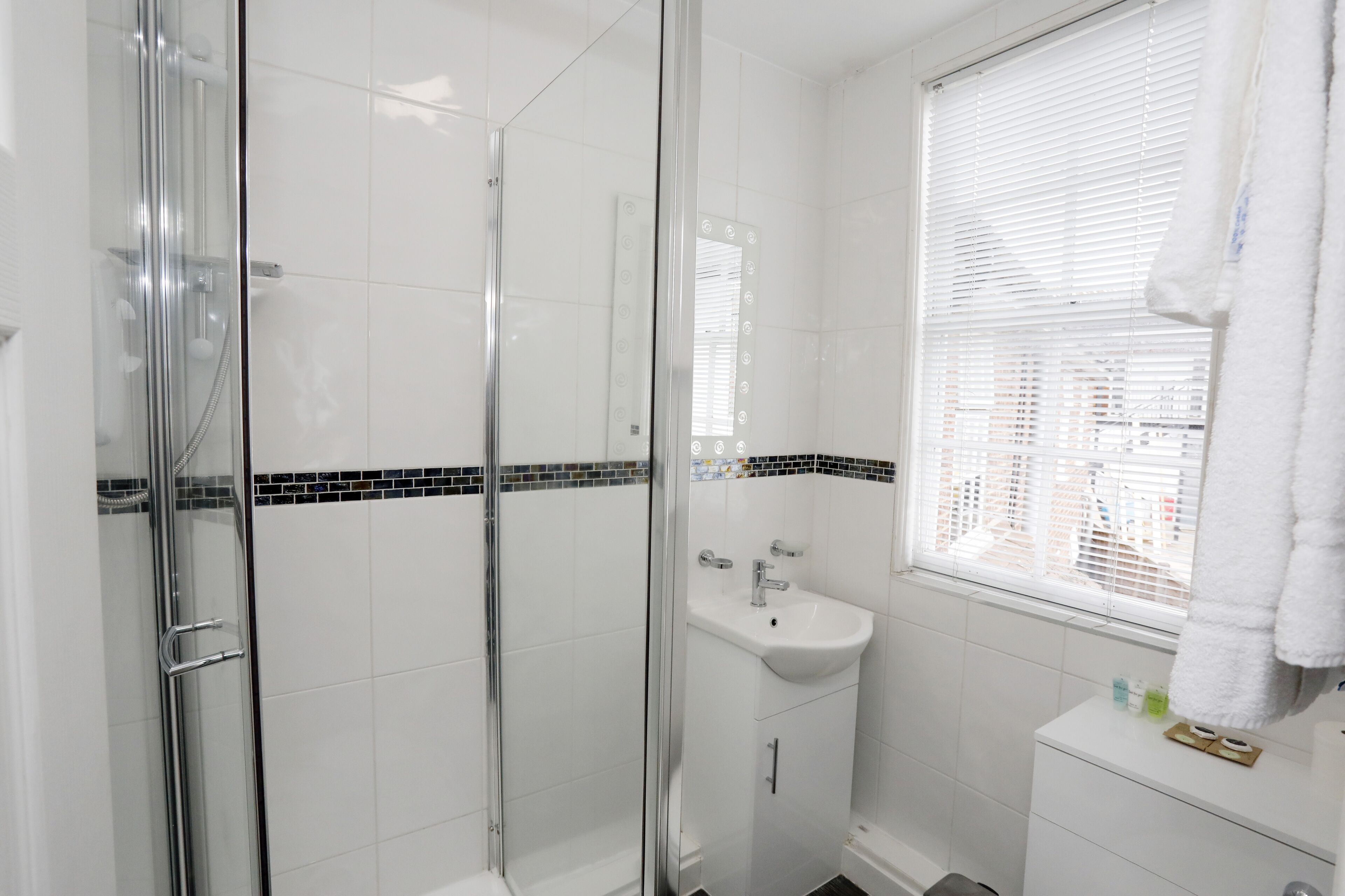 family room | bathroom | shower, free toiletries, hair dryer, towels