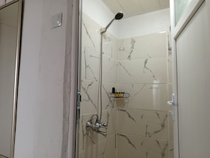 Shower, hair dryer, slippers, towels
