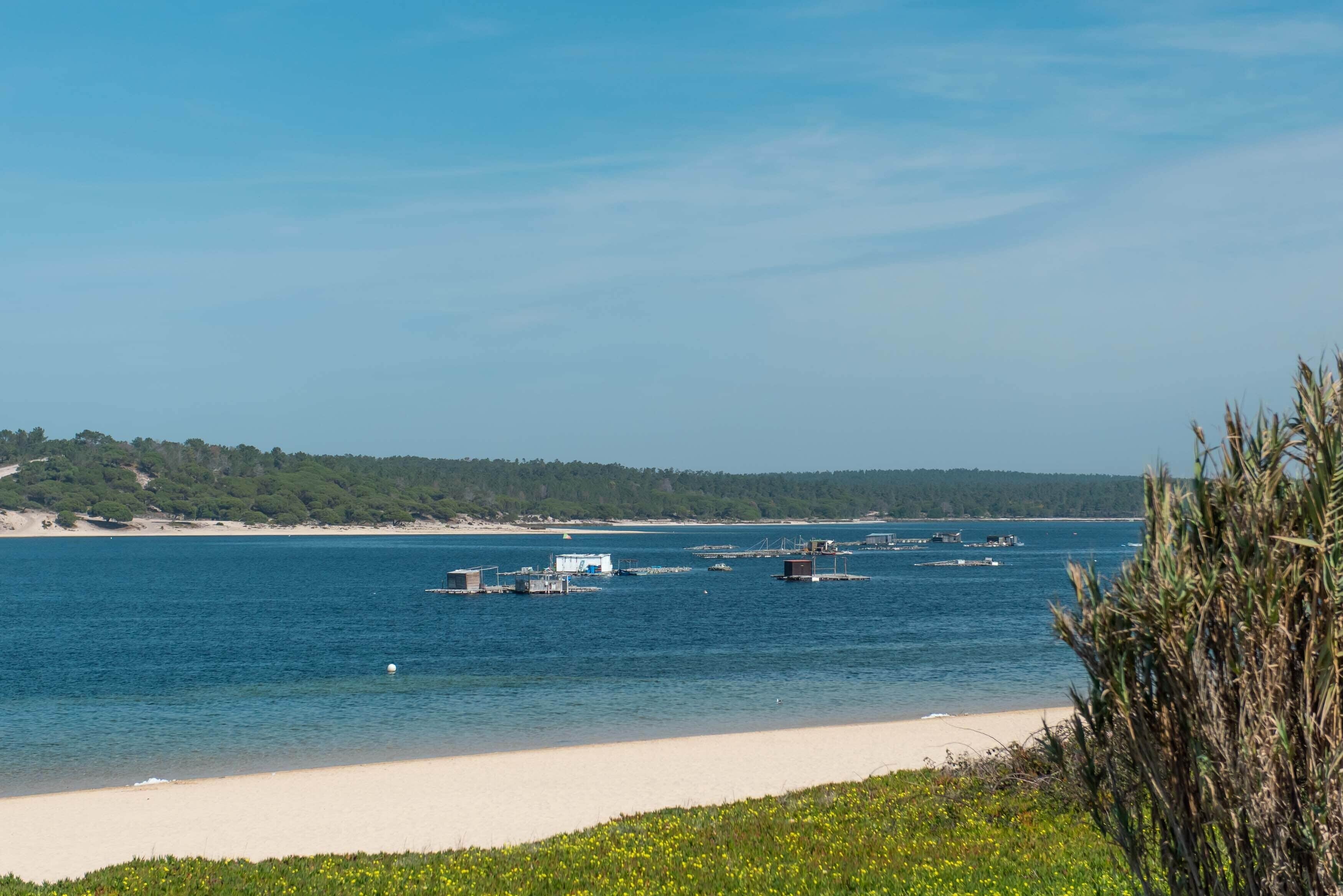 Beach nearby, white sand, beach umbrellas, beach towels