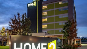 A hotel sign with "HOME 2 SUITES BY HILTON" and a building in the background. - Home2 Suites by Hilton Oklahoma City NW Expressway (Oklahoma City)