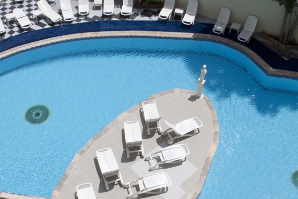 Seasonal outdoor pool, open 9:00 AM to 6:00 PM, pool umbrellas