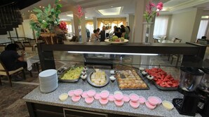 A buffet area with various food items and a coffee station. - Meryemana Hotel (Didim)