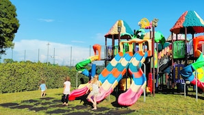 A playground with multiple slides and climbing structures. - Camping Village Roma Capitol (Rome)