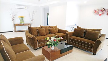 Executive Villa | Living area | 55-inch flat-screen TV with cable channels, Smart TV, Netflix