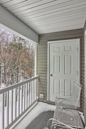Step out onto the covered porch and enjoy the serene view of the surrounding landscape.