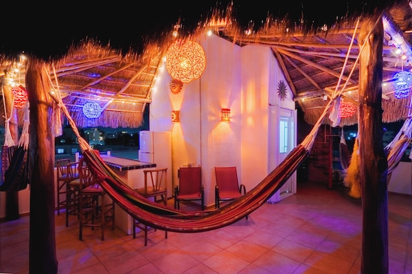 SKY DECK - Rooftop paradise w/a fiesta of colors, ocean breezes, BBQ & hammocks.