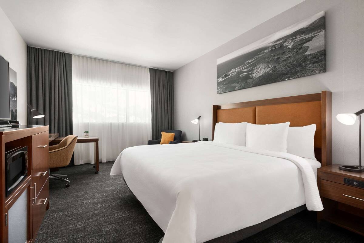 Premium bedding, desk, laptop workspace, iron/ironing board
