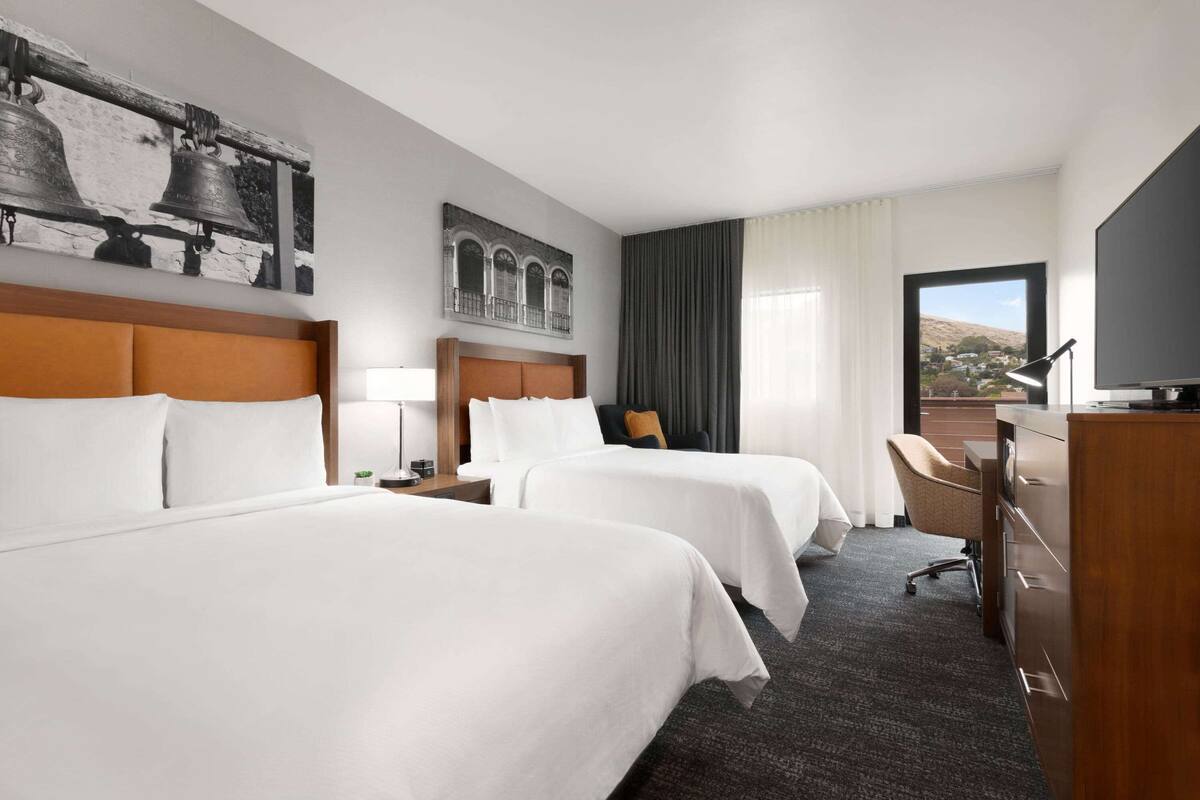 Premium bedding, desk, laptop workspace, iron/ironing board